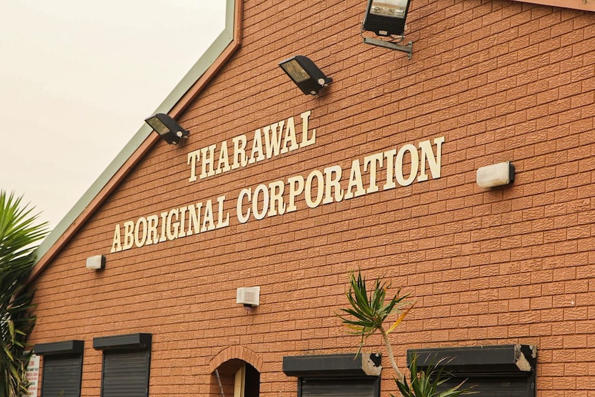 Tharawal Aboriginal Corporation sign on side of building.