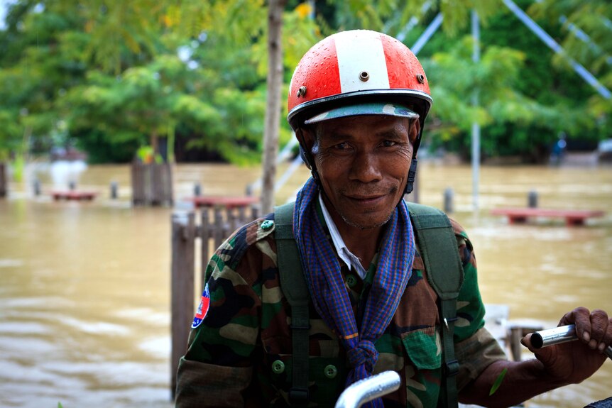 A Cambodian man makes his way through floodwaters in Siem Reap in late September, 2011.