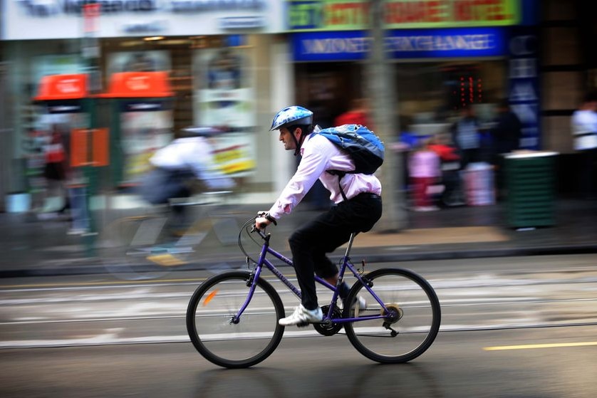 A cyclist makes his way to work in Melbourne on 'National Ride to Work Day'.