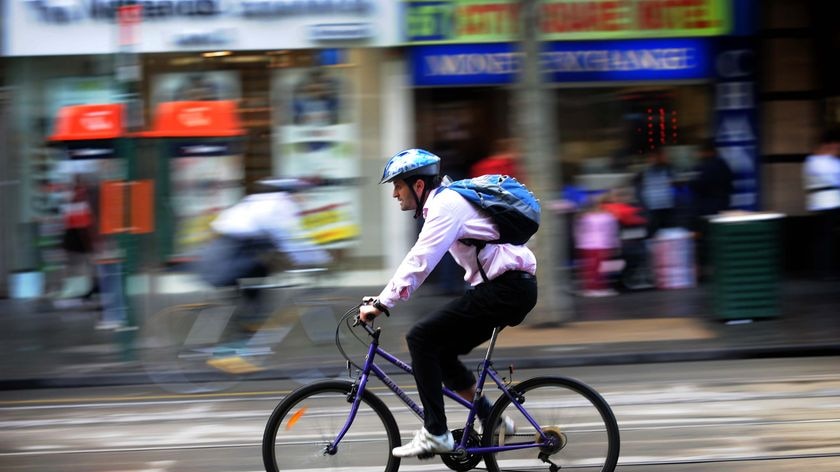 A cyclist makes his way to work in Melbourne on 'National Ride to Work Day'.