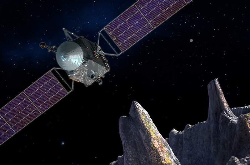 Artist's impression of the 16 Psyche spacecraft orbiting the asteroid it's named for.