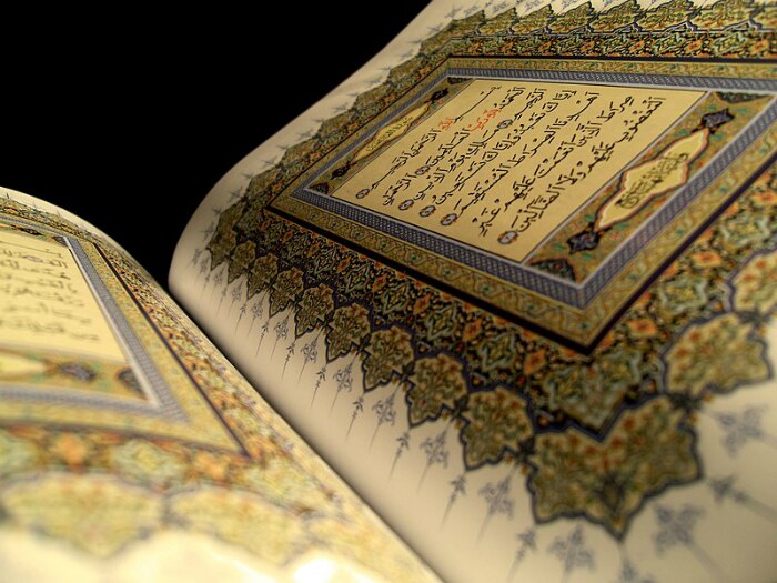 A page of the Quran open.