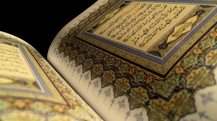 A page of the Quran open.