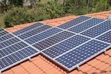 Solar panels on a terracotta tile roof