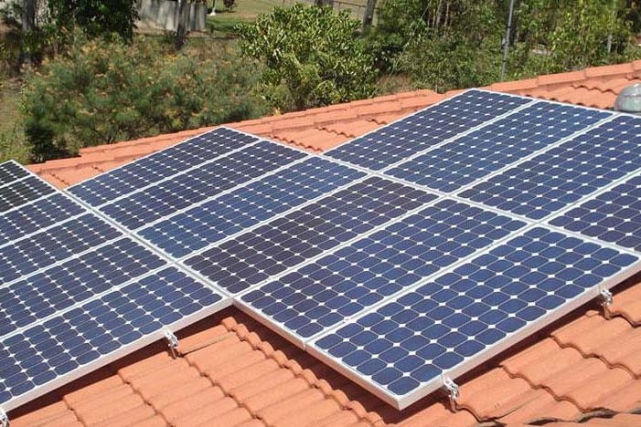 Solar panels on a terracotta tile roof