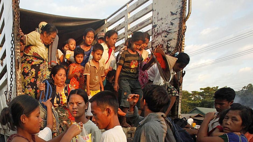 Burmese refugees arrive in the Thai border town of Mae Sot.