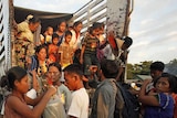 Burmese refugees arrive in the Thai border town of Mae Sot.