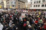 Show of dissent: Thousands of anti-APEC protesters gather at the Town Hall in Sydney