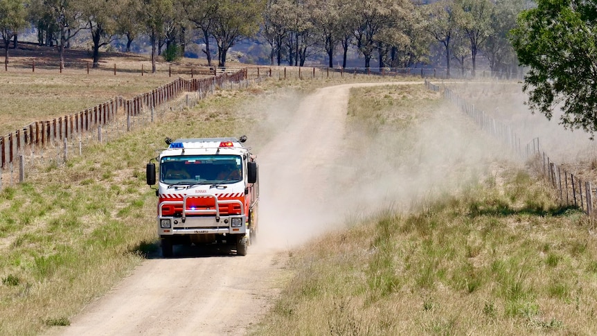 A fire truck on a dusty road