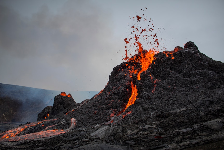 Lava spews from a volcano.