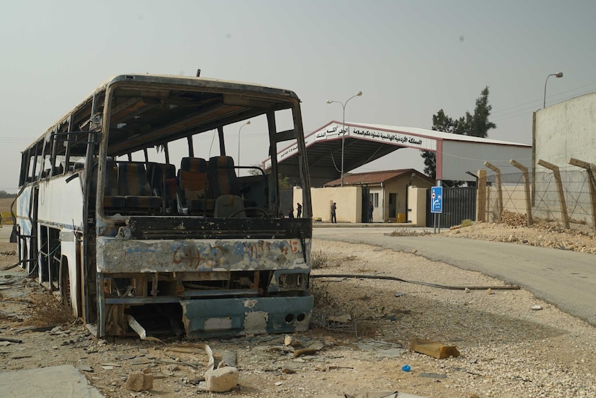 The wreckage of a bus on the Jaber-Nasib crossing Jordan Syria border