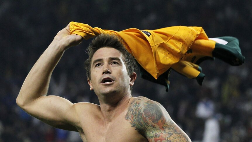 Cooling off: Kewell celebrates his 15th and another vital goal for Australia.