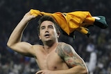 Cooling off: Kewell celebrates his 15th and another vital goal for Australia.