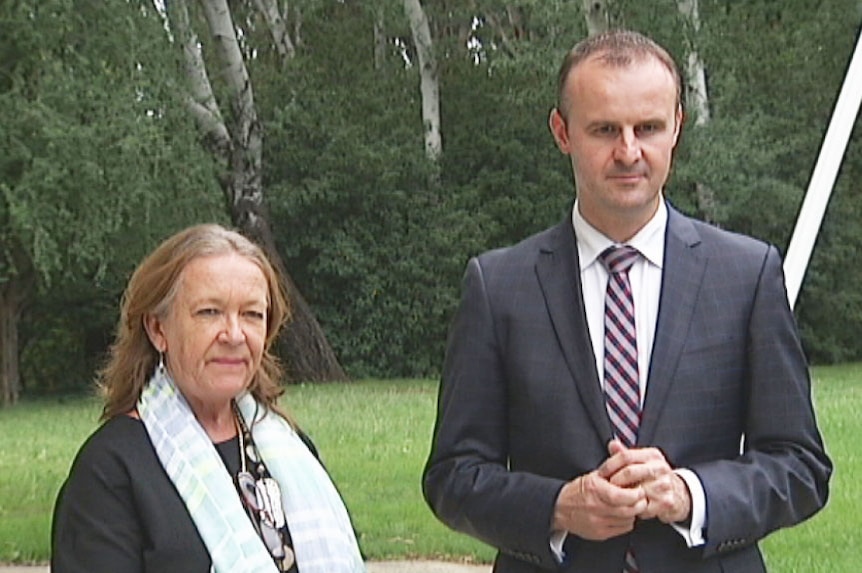 ACT Gaming Minister Joy Burch and ACT Chief Minister Andrew Barr share an awkward silence at a joint press conference.