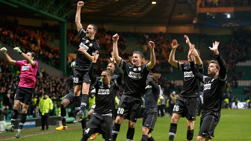 Juventus players celebrate after beating Celtic 3-0 in the first leg of their Champions League tie.