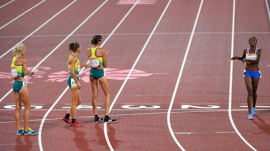 Celia Sullohern, Madeline Hills, Eloise Wellings of Australia congratulate Lineo Chaka.