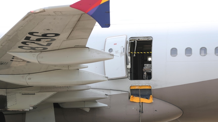 A view of an open door on a plane.