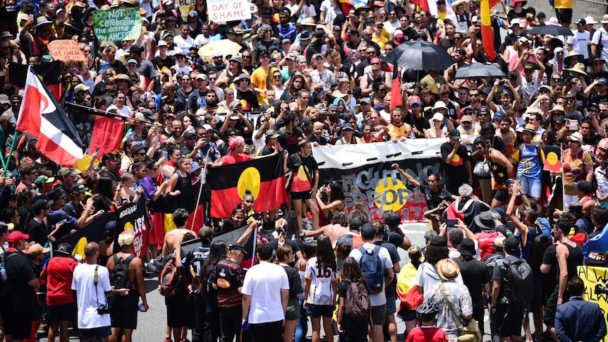 3000 people attended the Invasion Day march in Brisbane on Australia Day 2018, waving Indigenous flags  and signs.