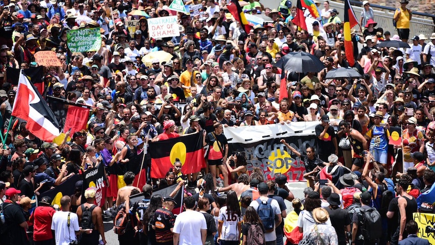 3000 people attended the Invasion Day march in Brisbane on Australia Day 2018, waving Indigenous flags and signs.