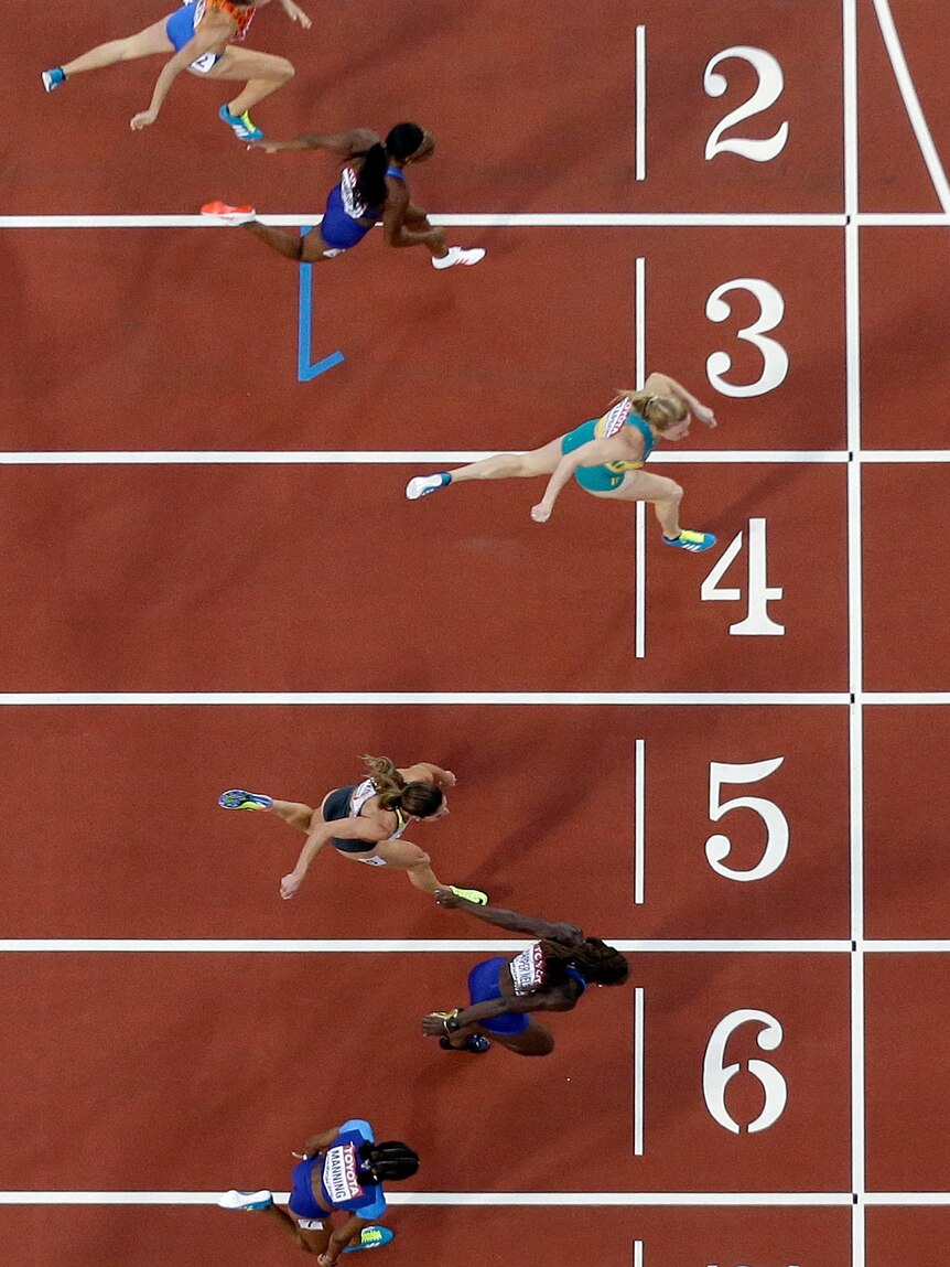 An overhead shot of Sally Pearson crossing the line first in the 100m hurdles.