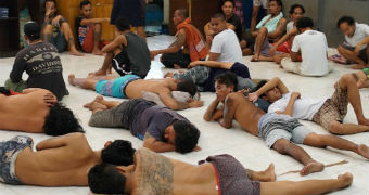 Prisoners lay on the floor of Kerobokan prison.