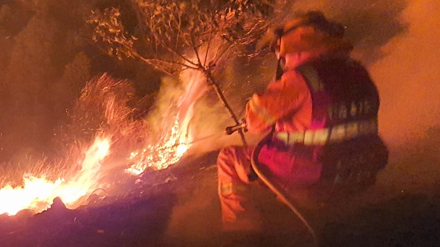 firefighter amongst a blaze.