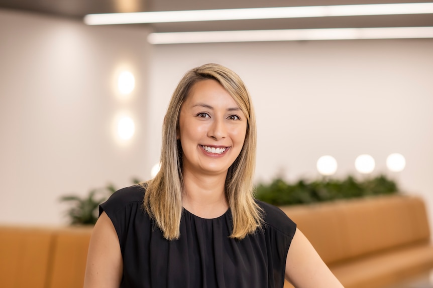 A smiling woman in an office