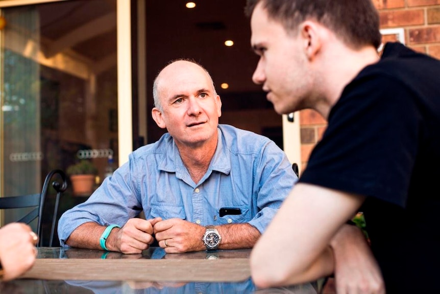 Father and son talking