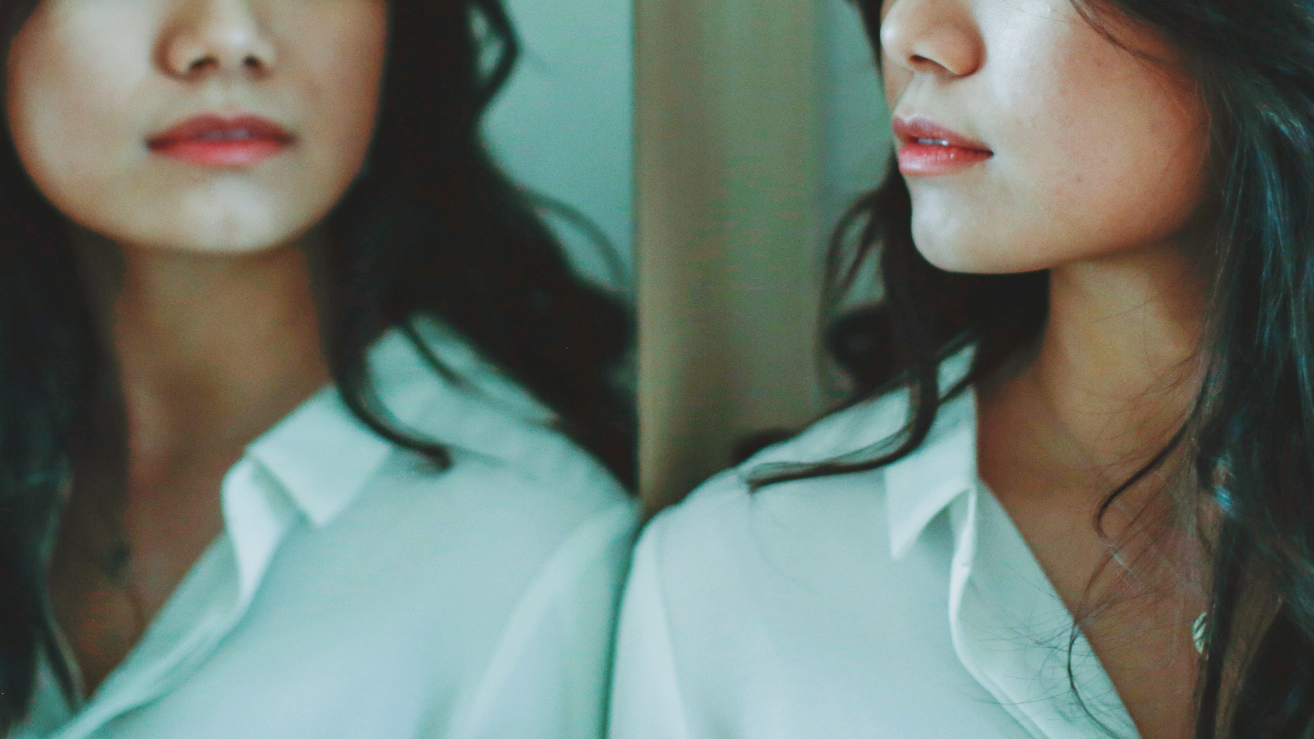 Close up of woman looking in mirror