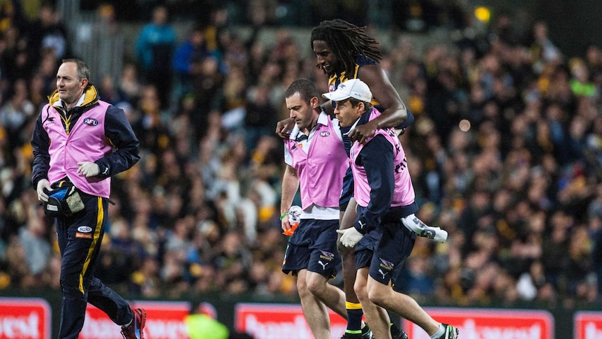West Coast Eagles ruckman Nic Naitanui is helped from the field