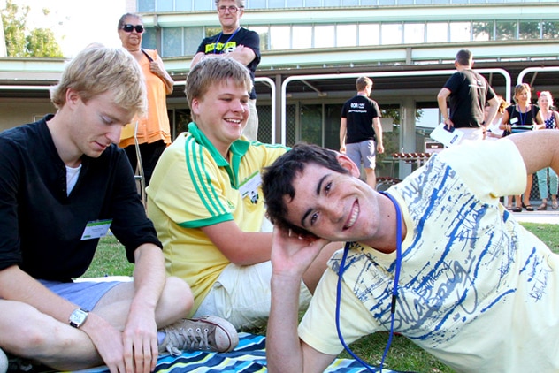 Image of contestants hanging out with athletes on campus