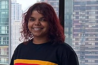 Young Indigenous woman, dark hair, black shirt