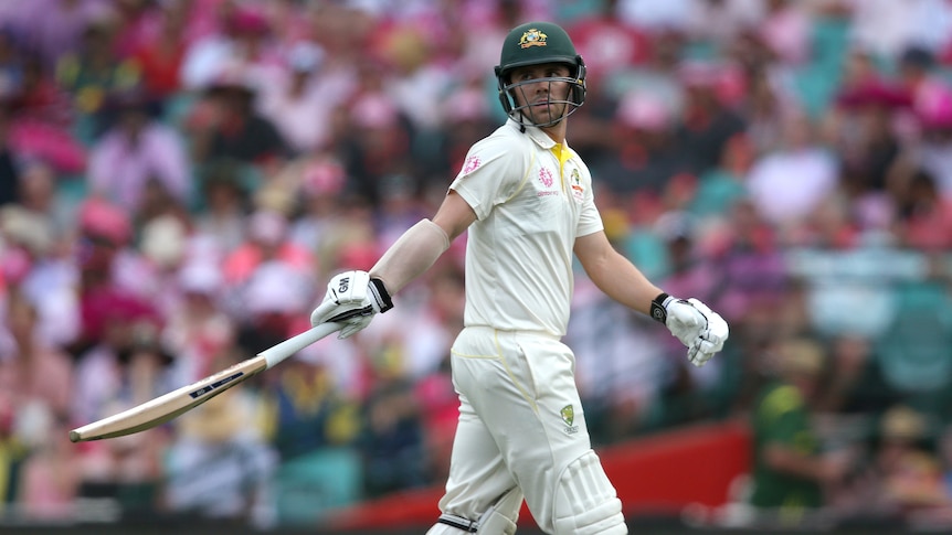 Travis Head looks on as he walks off the pitch after his dismissal against India