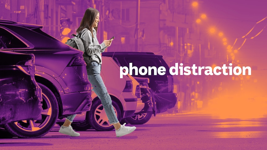A woman smiles at her phone as she dangerously walks out from a row of parked cars into the street. 