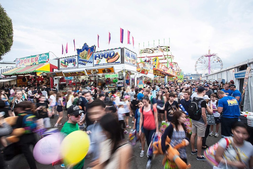 Crowd walk along displays at Brisbane's Ekka on People's Day in 2013.