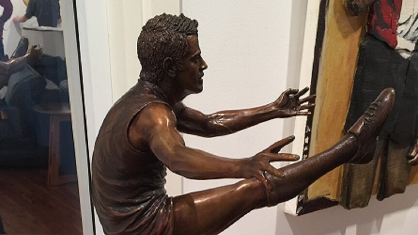 A small statue of former AFL player Mark Ricciuto.