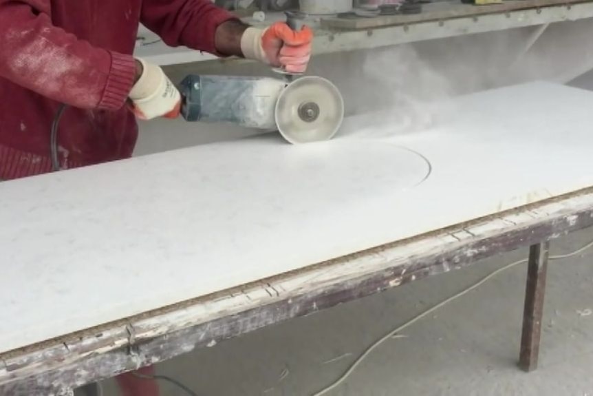 a slab of artifical stone being cut