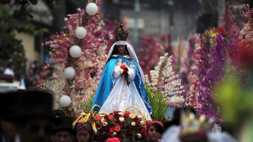 Catholics take part in a procession of the Conception Virgin in El Salvador