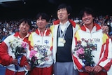 Chinese athletes Zhang Lirong (L), Wang Junxia (2L) and Zhana Linli (R) with coach Ma Junren (2R).