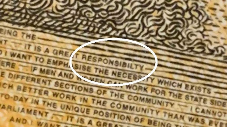 A close-up shot of the typo in the word "responsibility", missing the third "i" on the new $50 note.