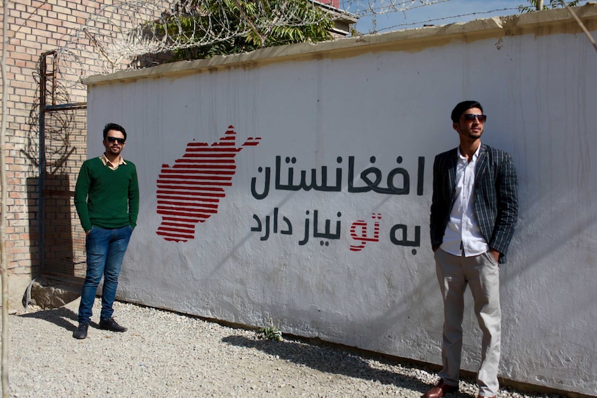 Moez Popalzai and Shakib Mohsanyar painted an Afghanistan Needs You mural at Kabul's passport office