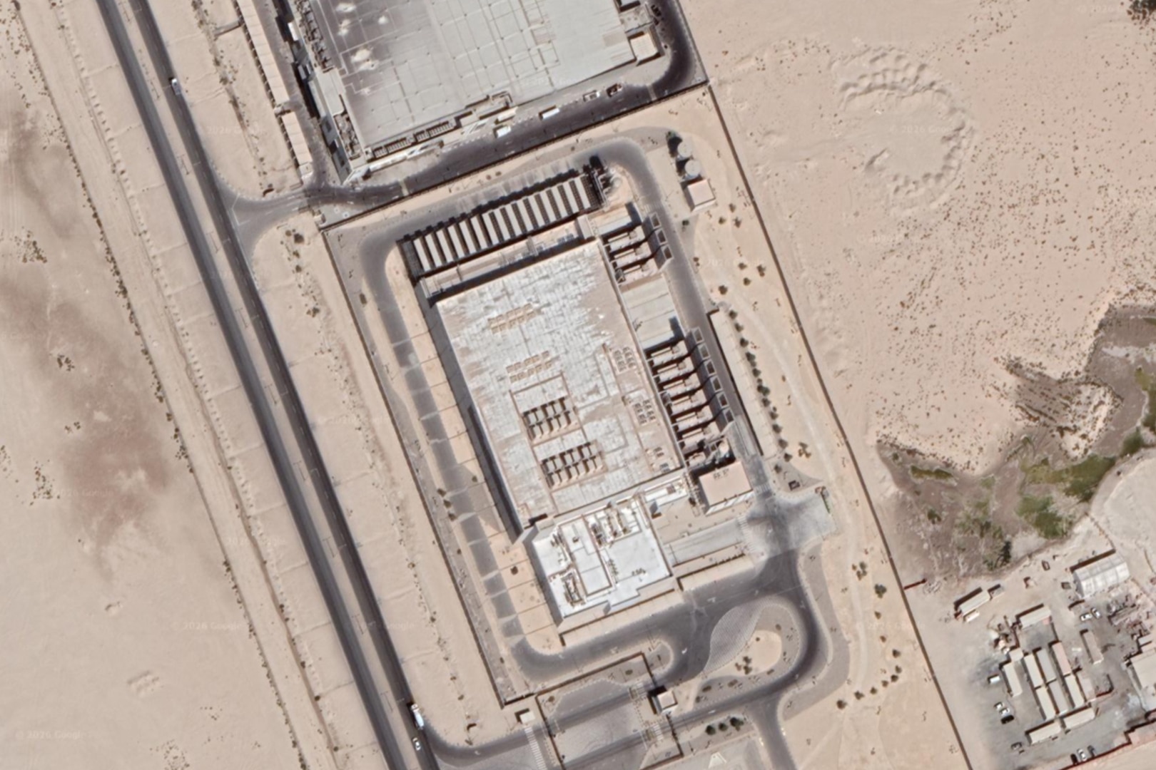 A satellite image of a data center in the desert.
