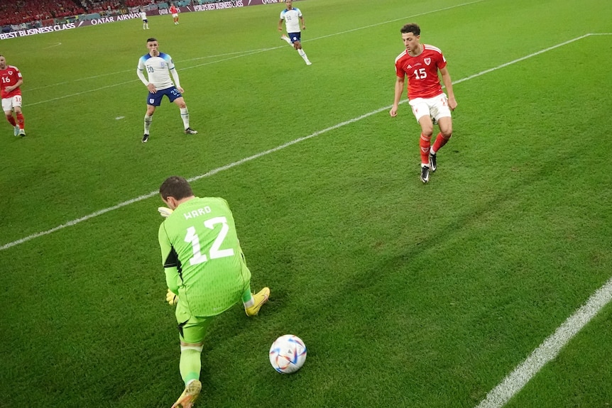 The ball sneaks through Danny Ward's legs near the goalline