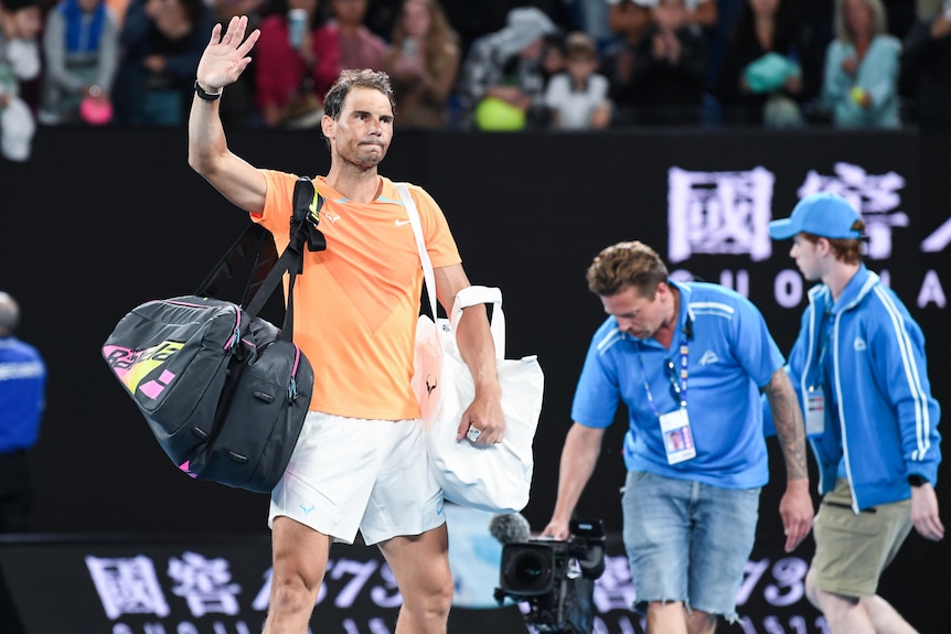 Rafael Nadal waves to the Rod Laver Arena crowd.