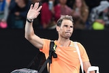 Rafael Nadal waves to the Rod Laver Arena crowd.