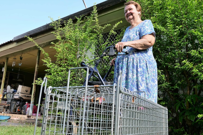 Cynthia Cooper, 83, from Moil NT with a cat trap in her back yard