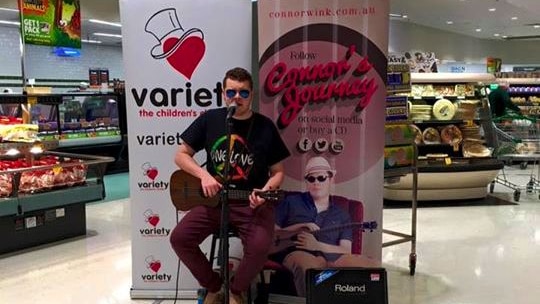Vision impaired ukulele player, Connor Wink, raising funds for Variety at an East Maitland supermarket.