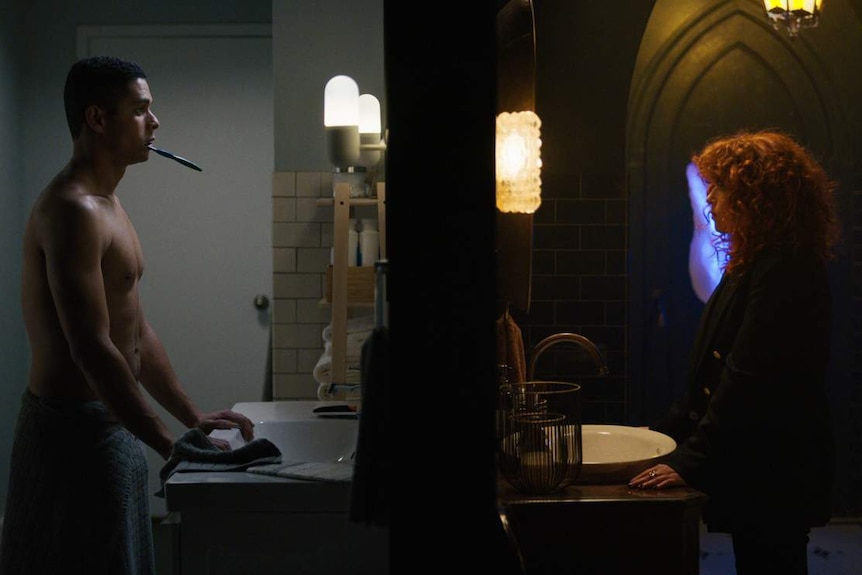 Split-screen still featuring two bathrooms: one minimalist with man brushing teeth, another grungy with woman staring in mirror.