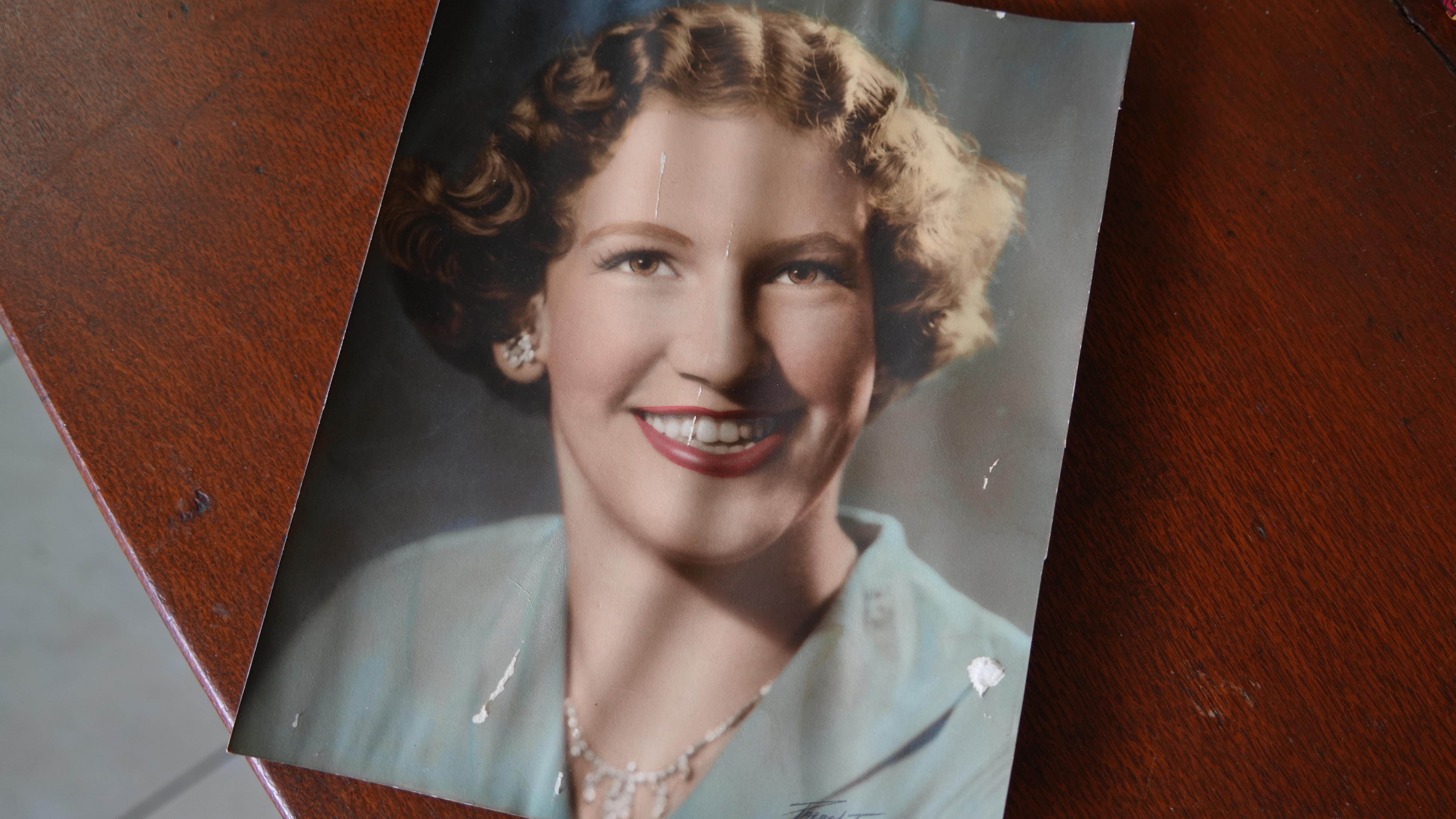 A photo of a photo of a young woman smiling