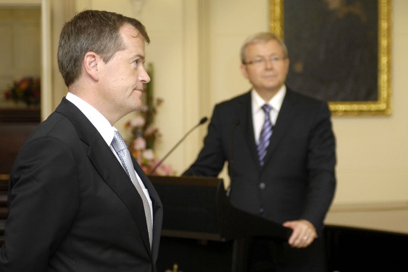 Kevin Rudd watching in the background as Bill Shorten is sworn in